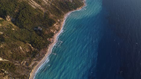overhead view of magnificent blue waters of megali petra beach, lefkada, greece