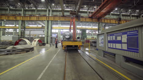 large metal object being transported in a factory