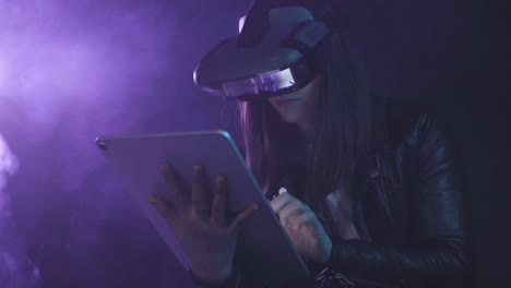 unrecognizable woman in vr glasses browsing tablet