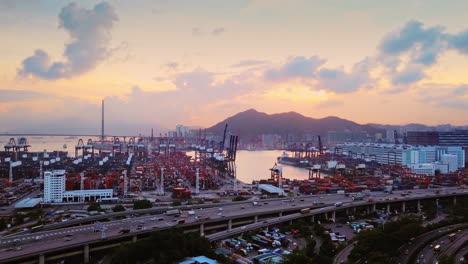 Aerial-Sunset-View-of-Hong-Kong-Kwai-Chung-Container-Terminal,-Highway-3,-Highway-5,-and-Stonecutters-Bridge