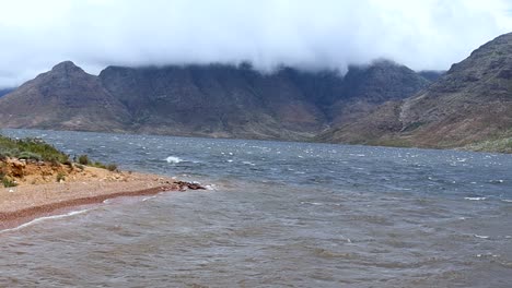 windy lake and misty mountains