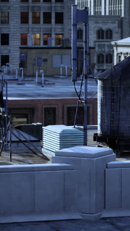 aerial view of city rooftop with water tank and pipes