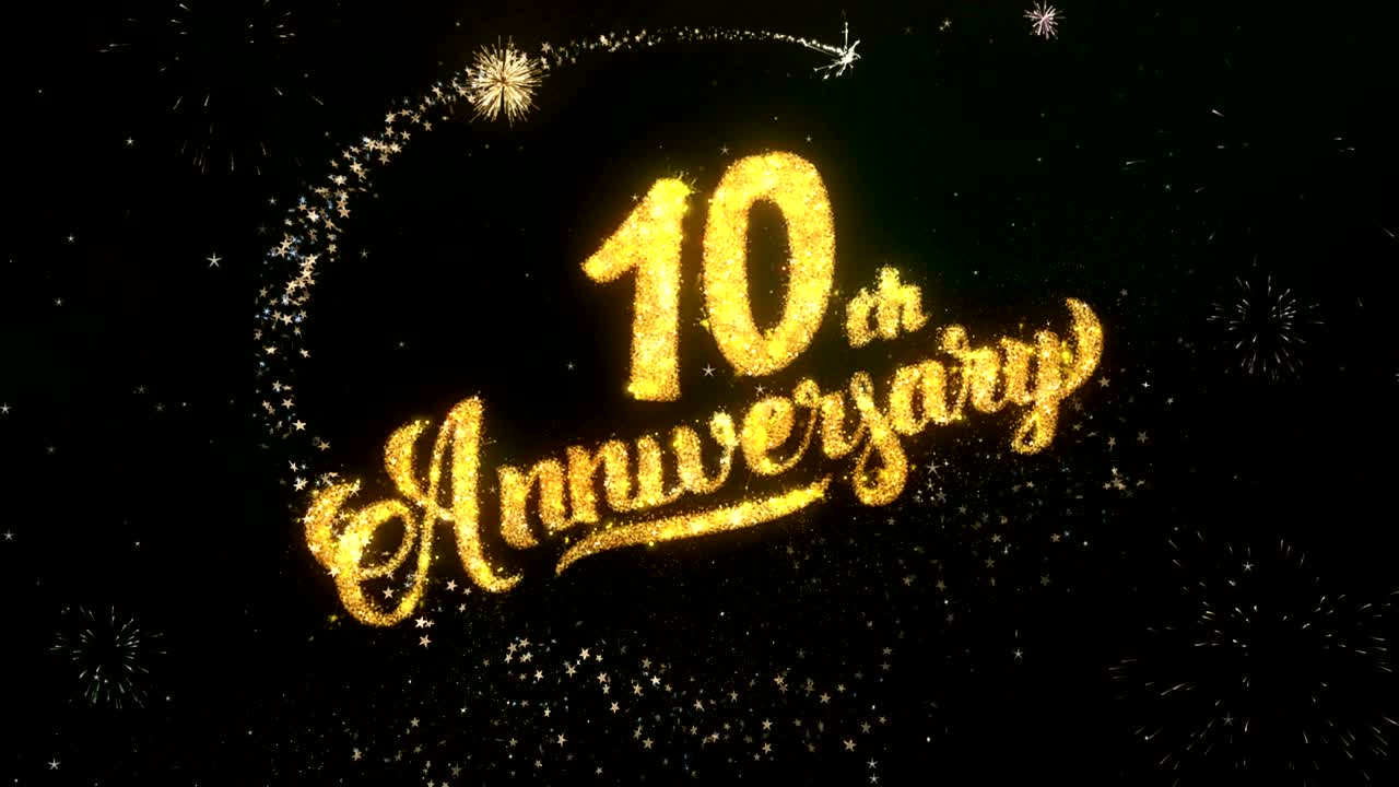 10th Anniversary Greeting and Wishes card Made from Glitter Particles and Sparklers Light Dark Night Sky With Colorful Firework 4k Background.