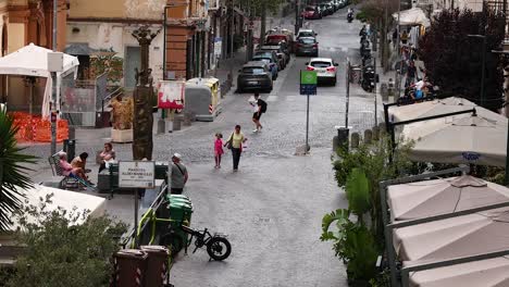 people walking and interacting on a busy street