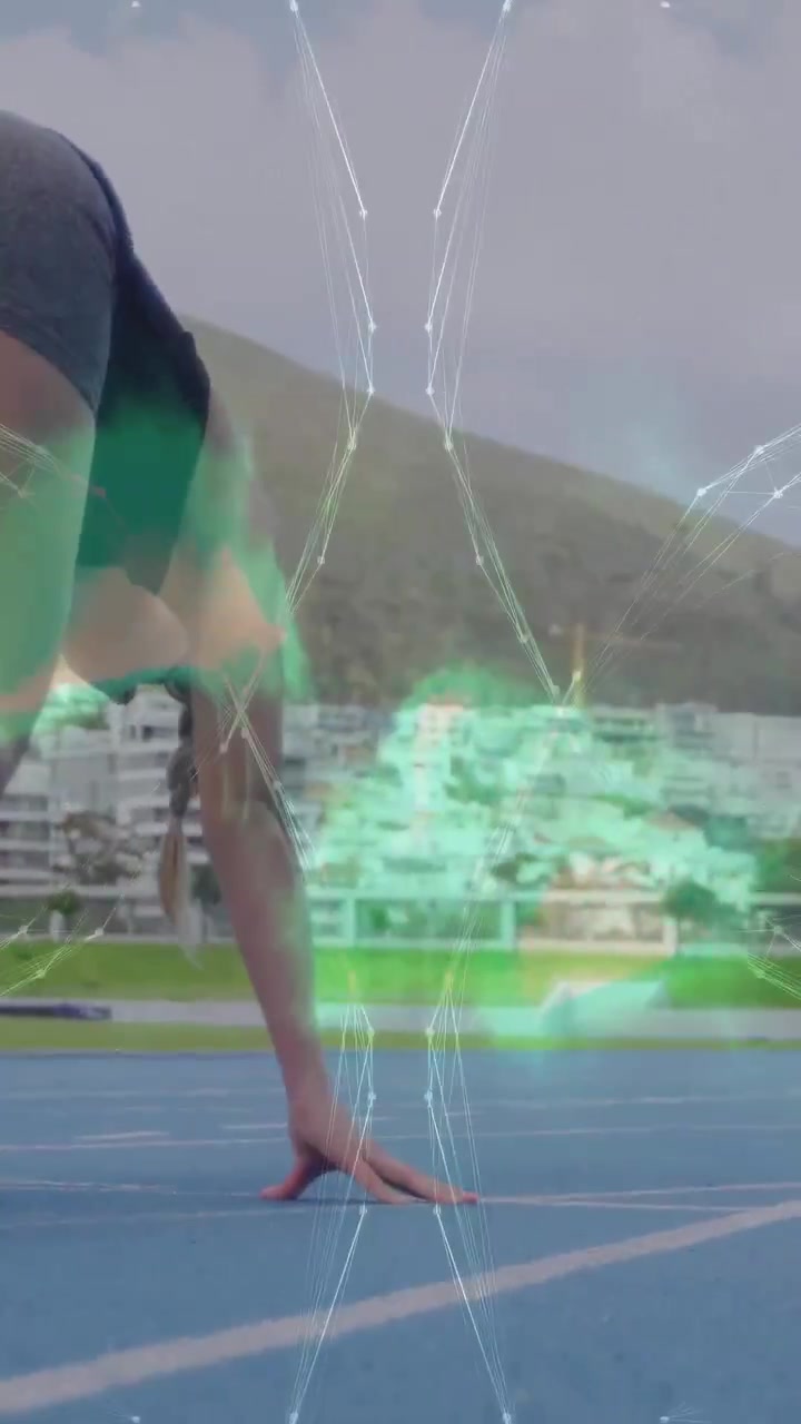 Sprinter che reagisce a un'interfaccia sportiva a forma di X, regolando la mano sulla pista blu, preparandosi per lo sprint.