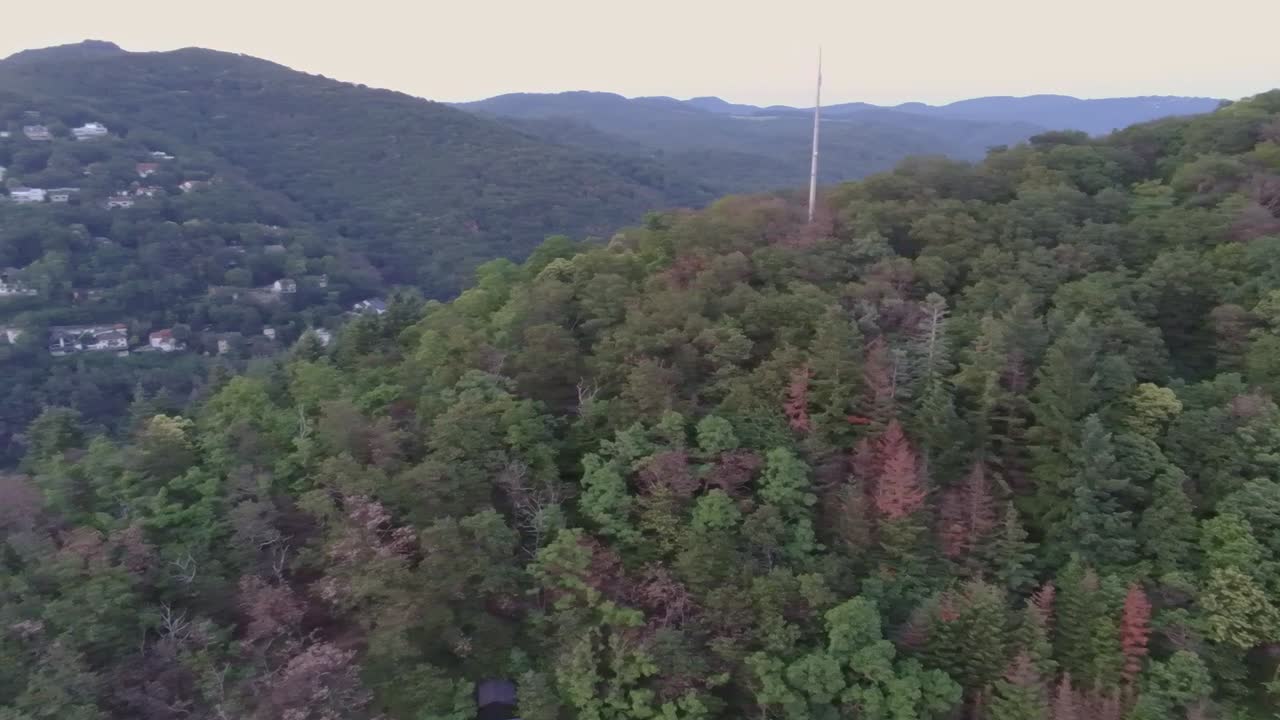 Panning view over mountains and Strahlenburg castle in the city of Schriesheim Germany during sunset.