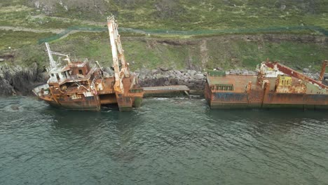 aerial view rusty mv alta shipwreck split in half aground at ballycotton, ireland