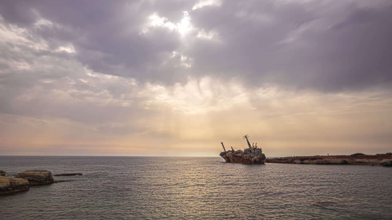 Timelapse of The Edro III Shipwreck with Sun Ray's Beaming Down onto the Ocean Surface Through the Clouds