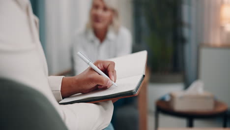 therapist taking notes during a therapy session