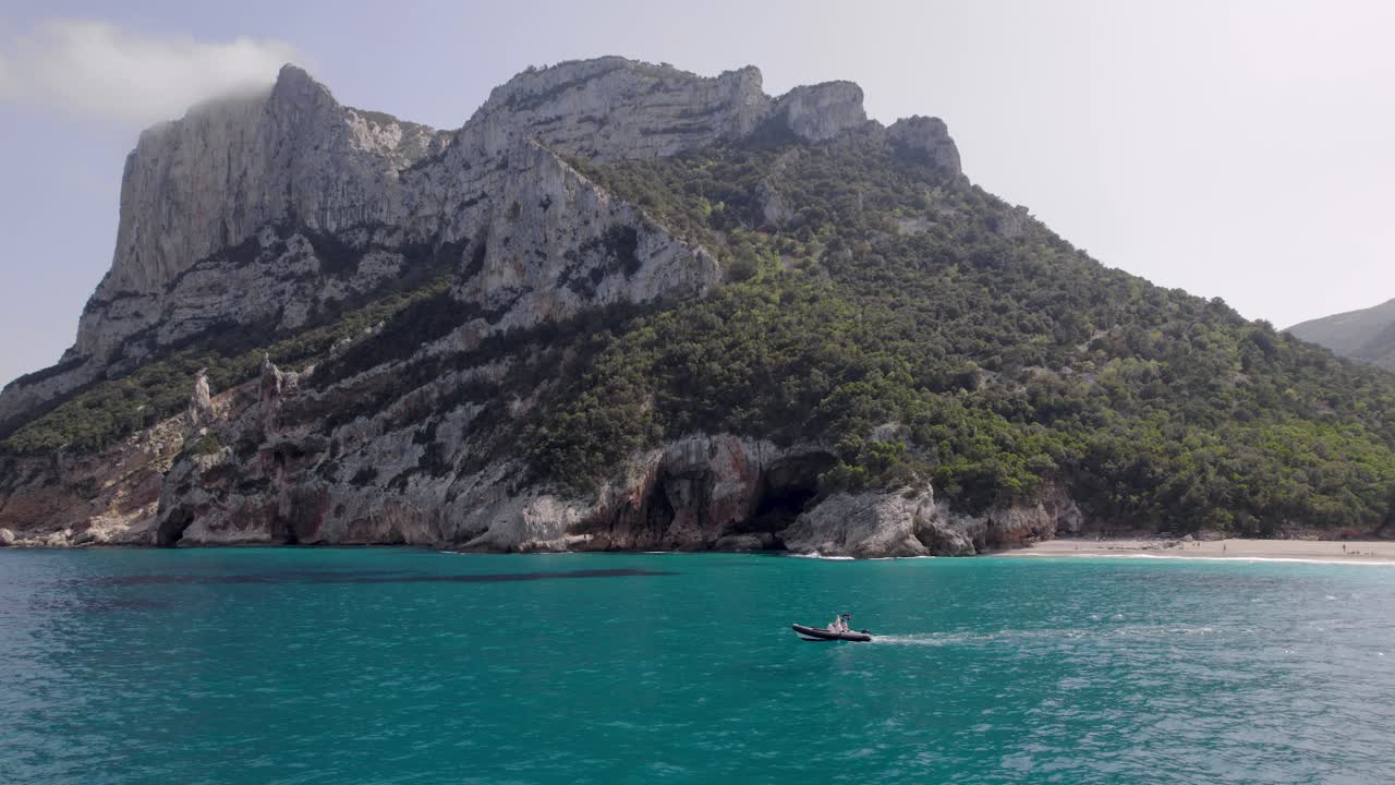Boating On Calm Blue Sea Near Cala Sisine On Baunei Coast, Gulf Of Orosei In Sardinia, Italy