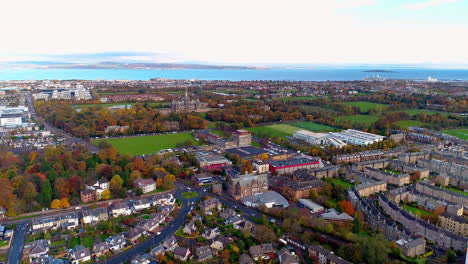 aerial track from right to left above stewart's melville college looking north towards fife and the firth of forth