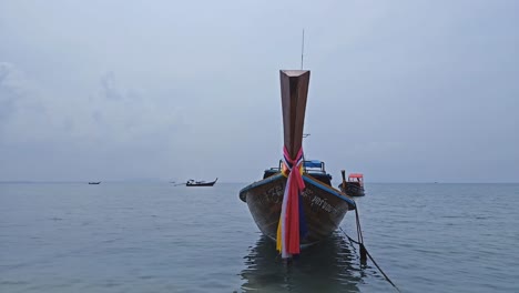 longtail boats on the beaches of thailand