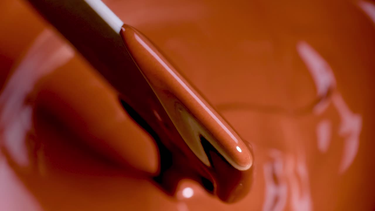 Smooth chocolate stirred with a spatula