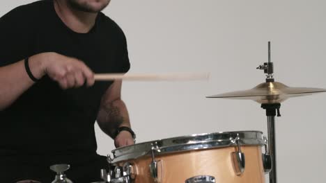 guy with blue hair plays the drums