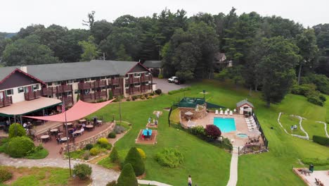 4k drone video of mountainside resort at little switzerland, nc on summer day-5