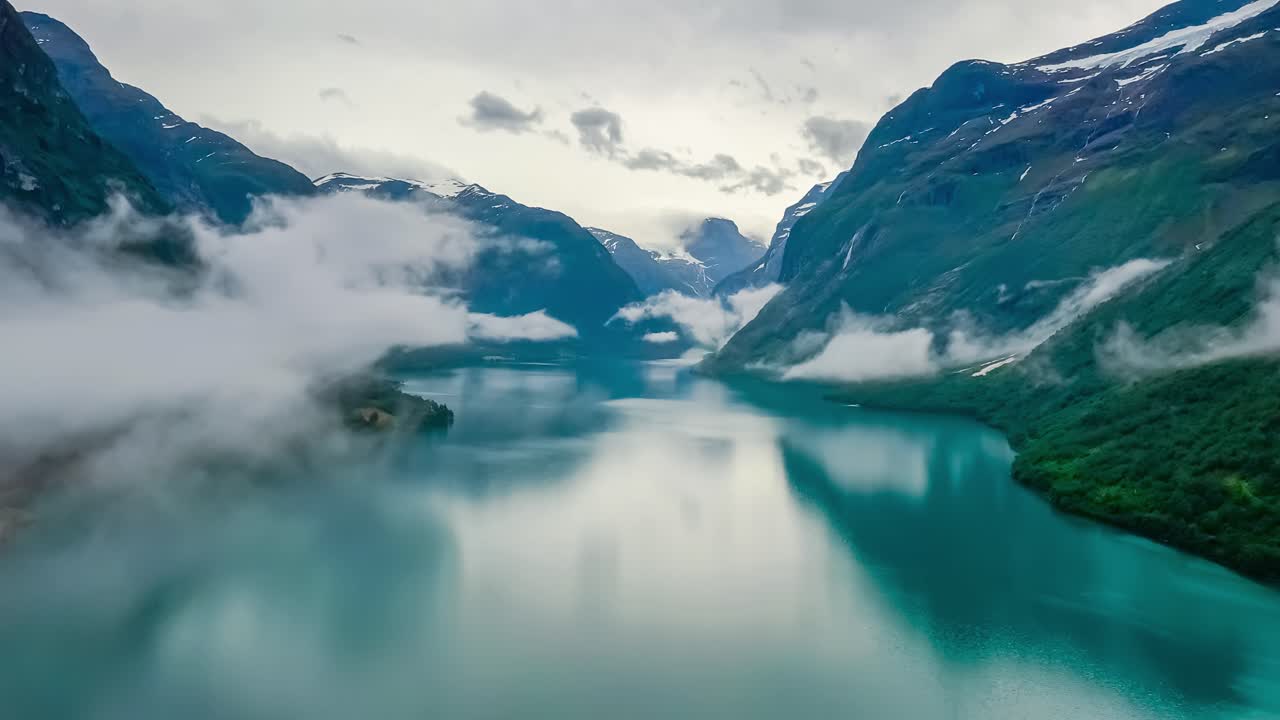 Beautiful Nature Norway natural landscape lovatnet lake flying over the clouds.