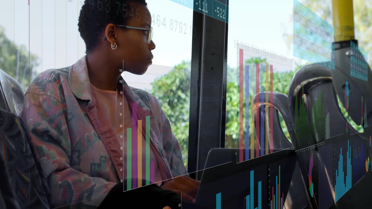 On bus, person using laptop with colorful data charts overlaying window view