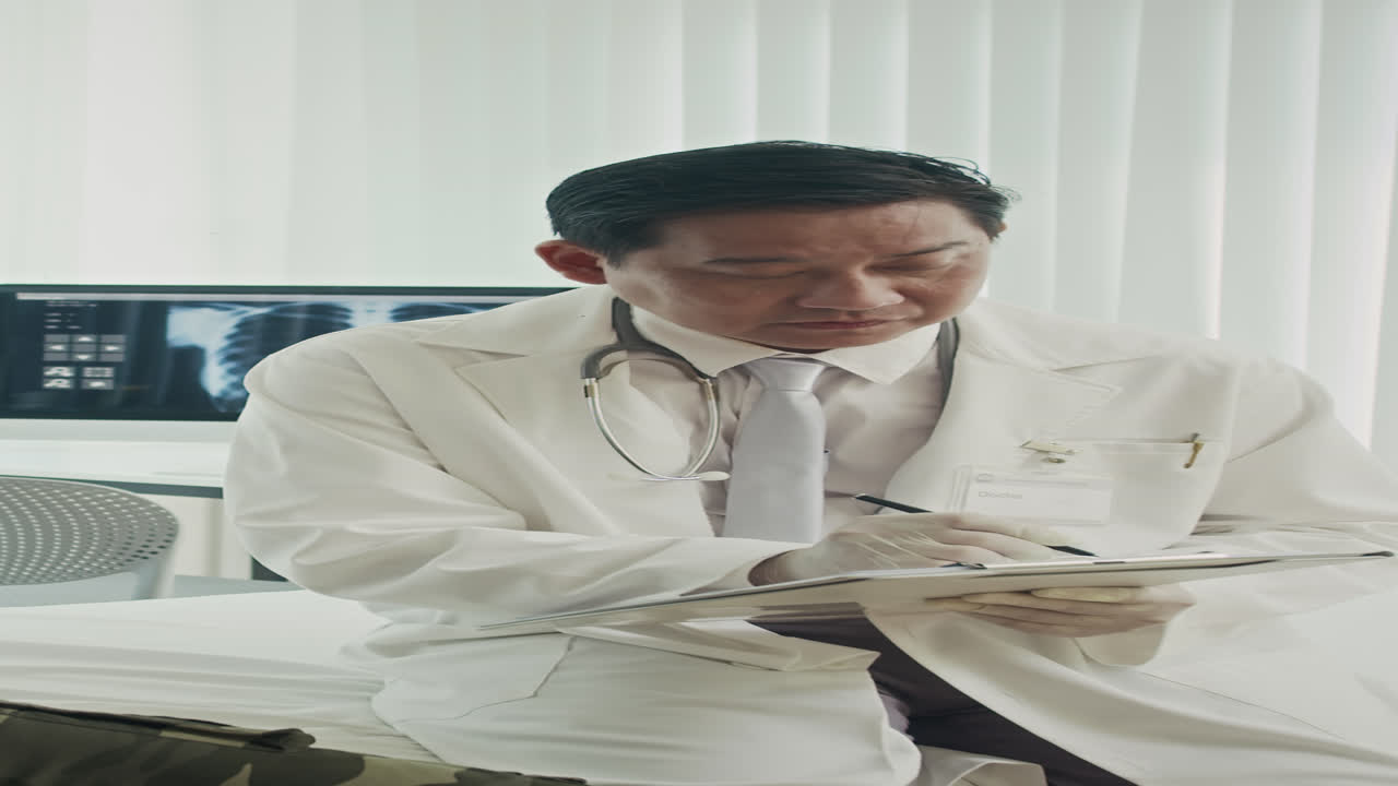 Medician Consulting Injured Soldier at Clinic