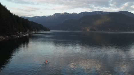 aerial view of person paddling kayak in deep cove, a community in north vancouver, british columbia