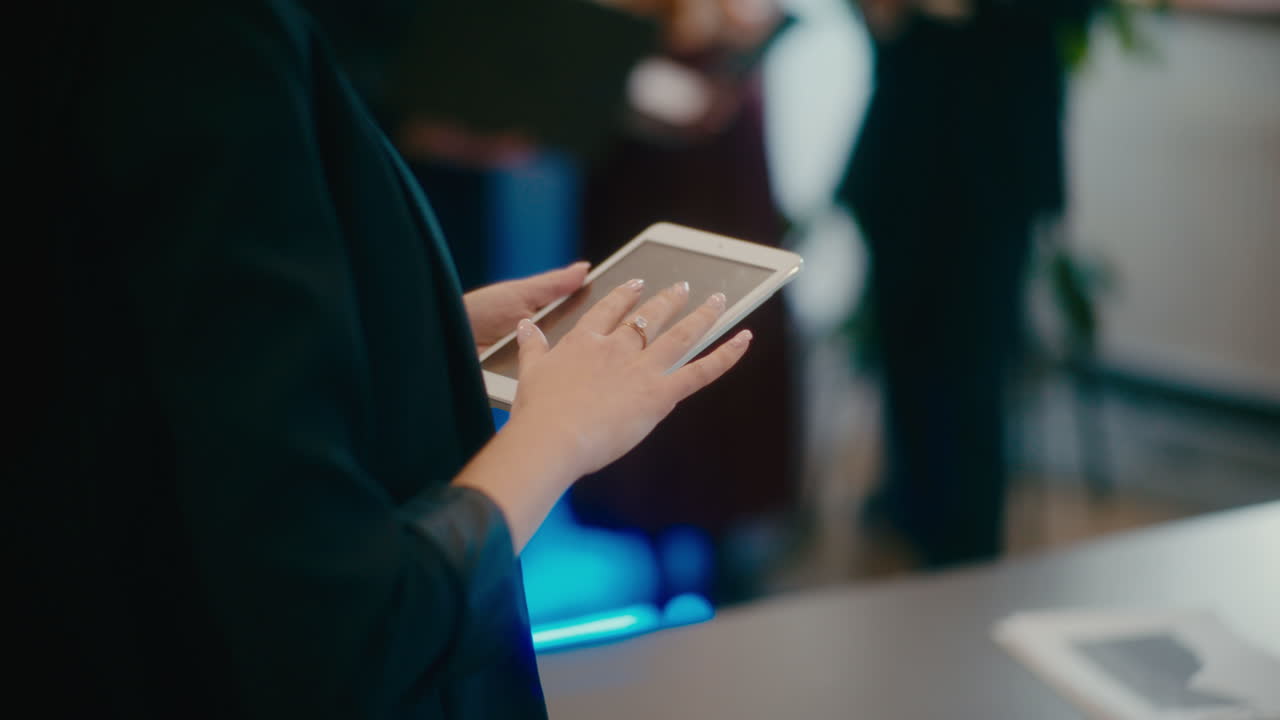 Businesswoman using tablet PC in office.
