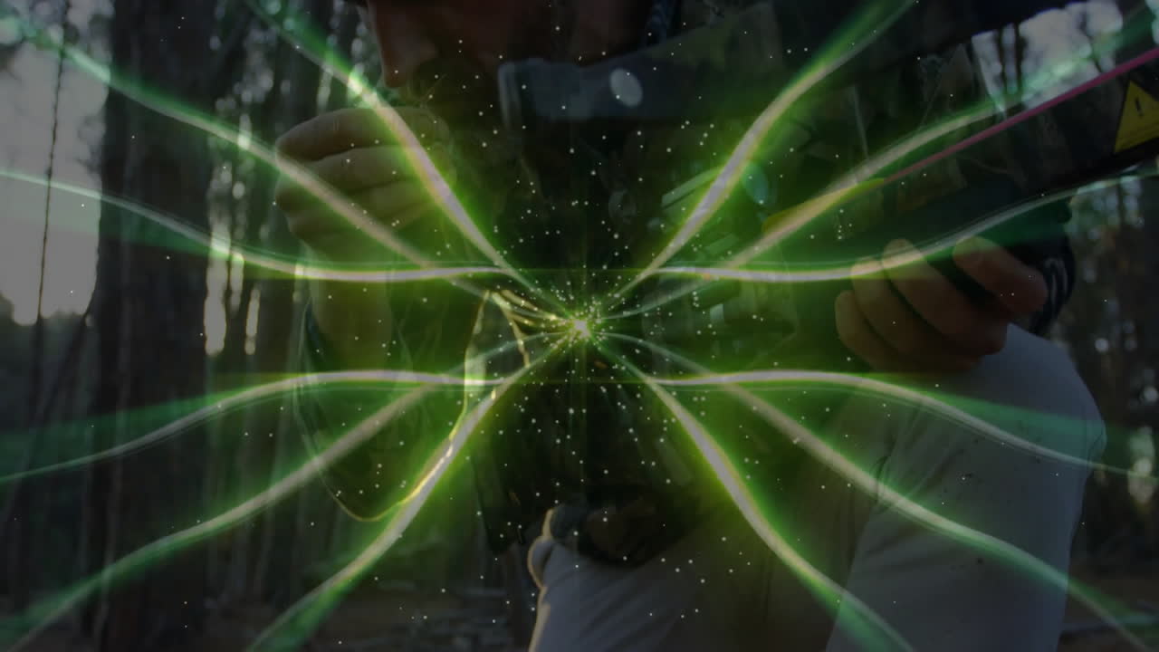 Mature male archer drawing compound bow in forest, overlaying neon-green tech trails