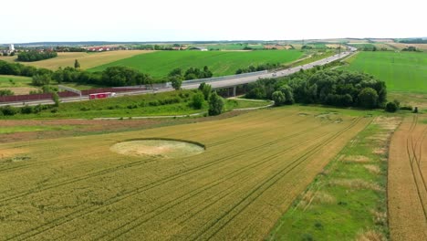 crop circle in vast agricultural field - aerial drone shot