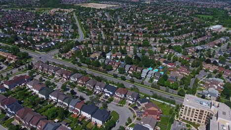 whitby real estate property market overhead with houses and roads, aerial drone shot, canada