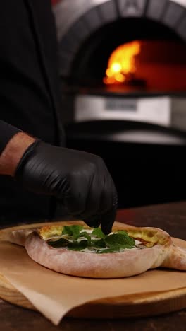 chef preparing khachapuri in a kitchen