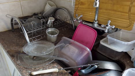 Many-dirty-dishes-in-the-kitchen-sink