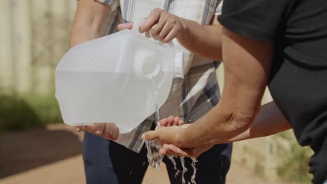 washing of arms and hands with plastic canister