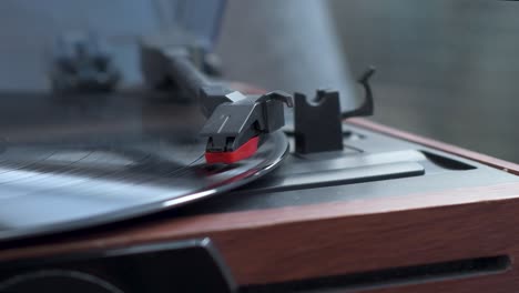 view of vinyl record spinning on turntable while music playing