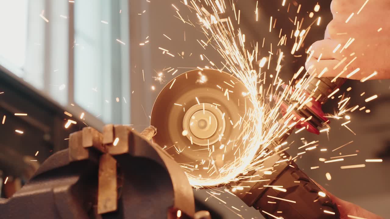 Close up of sparks from a grinder slicing through iron bar