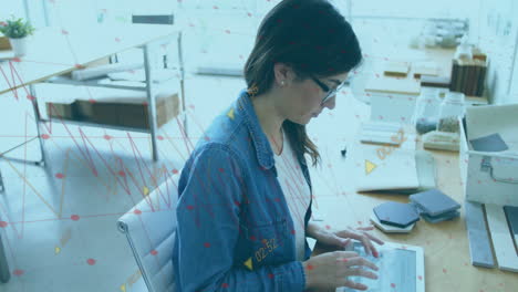 typing on tablet, woman with glasses, data analytics animation in office background