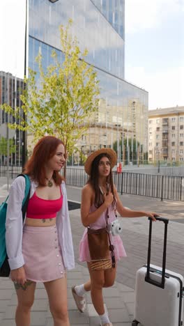 two women traveling in the city