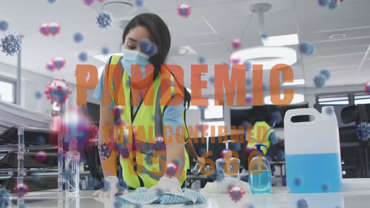 사무실을 소독하는 직장 동료들과 함께 떠다니는 단어 유행병과 코로나19 세포의 애니메이션