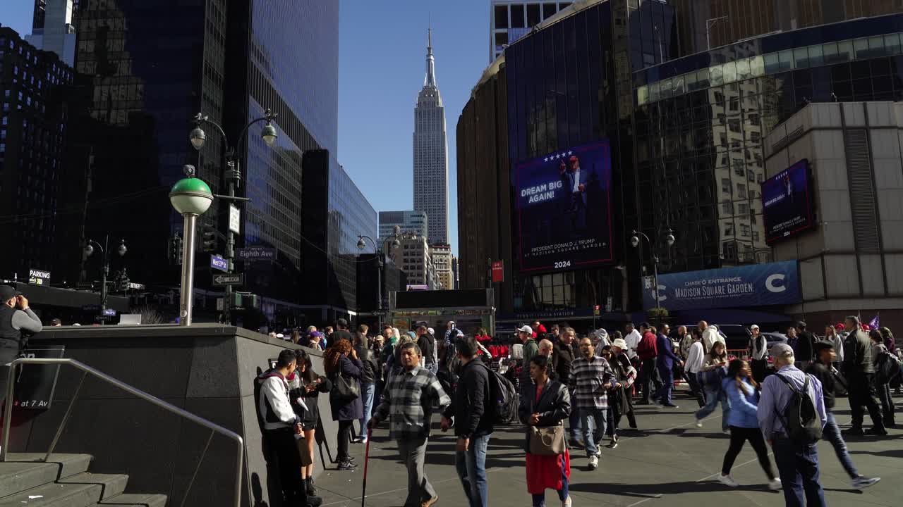 People pour into the area near Madison Square Garden, their excitement for Trump visible as the sun shines down on the gathering