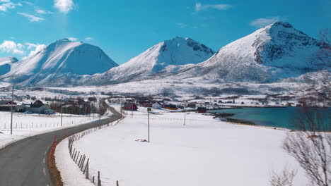 cinematic shot tracking through a village in rural norway