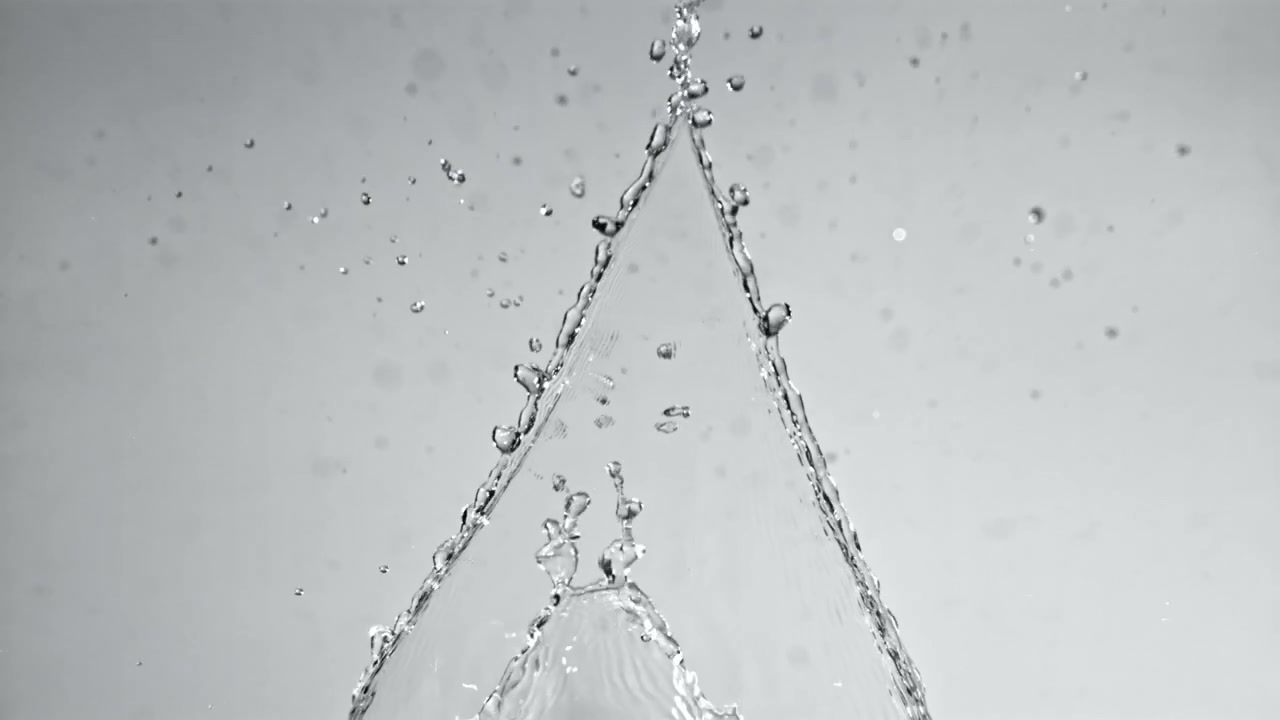 Slow Motion Clear Water Splashing and Forming Droplets