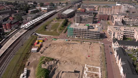 aerial descend and reveal of noorderhaven neighbourhood ubuntuplein construction site in urban development real estate investment project