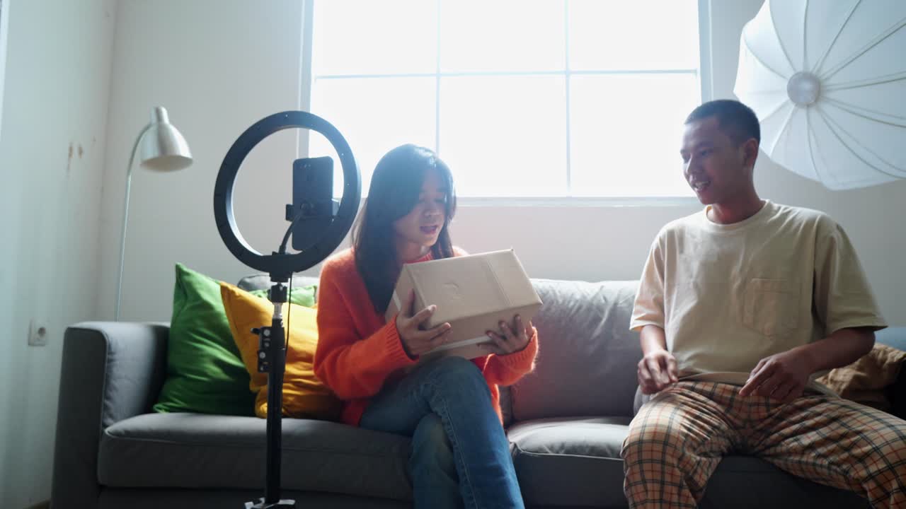 Couple Unboxing and Reviewing a Product for their YouTube Channel