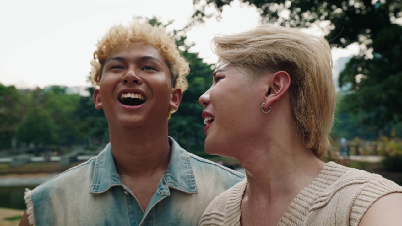 Two men smiling in a park