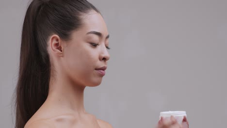 woman applying face cream