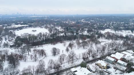 Static aerial shot of snow covered Piedmont Park in Atlanta, Georgia on January 10th 2025.