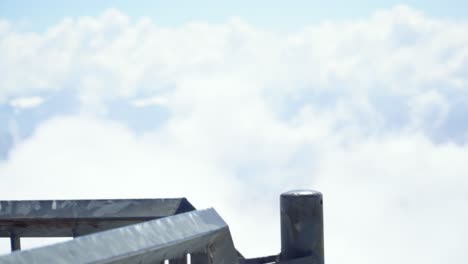 Alpine-Chough-a-Black-Bird-Sitting-on-Railing-on-Mountain-Summit