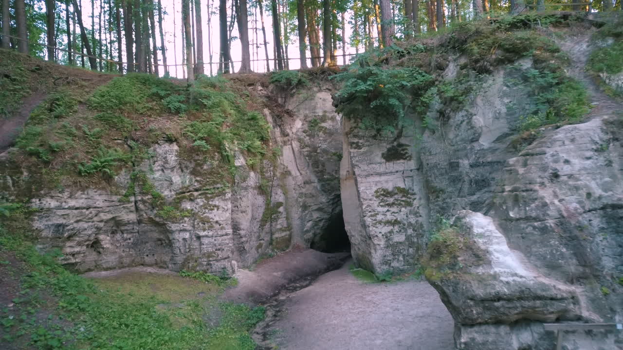 Devil's Oven or Large Ellite Natural Geological Monument  Located in the Gauja National Park at Lode Behind Cesis in Latvia. Licu – Langu Sandstone Cliffs Liepa Cave. Aerial Dron Shoot.