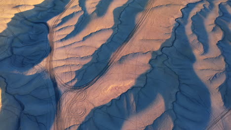 factory butte and badlands with morning light near hanksville, utah - drone shot