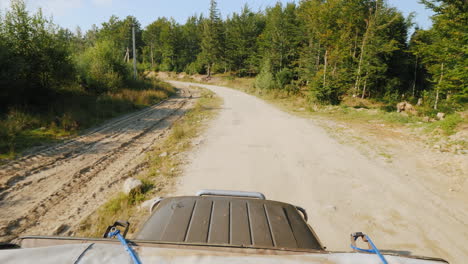 suv rides on an extremely bad dirt road a top view stabilized on 3 axes shot