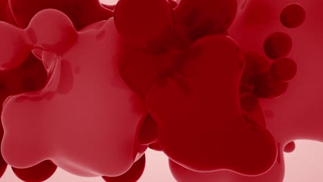 deep red and pink abstract animation of glossy blobs coalescing and flowing on light background, viscous motion