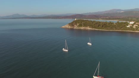 aerial view of sardinia italy holiday destination with sail boat in a stunning natural wild bay