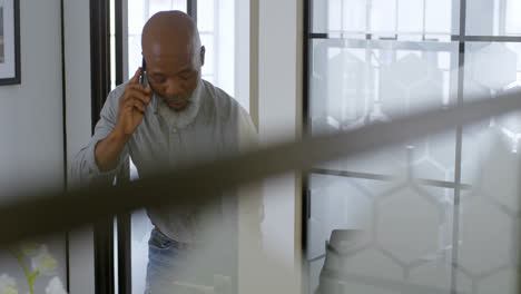 Businessman-talking-on-phone-at-office-4k